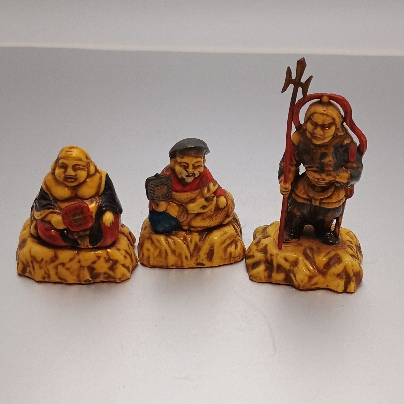 Set of 3 Asian Resin Figurines Yellow Red Brown Decorative Collectibles