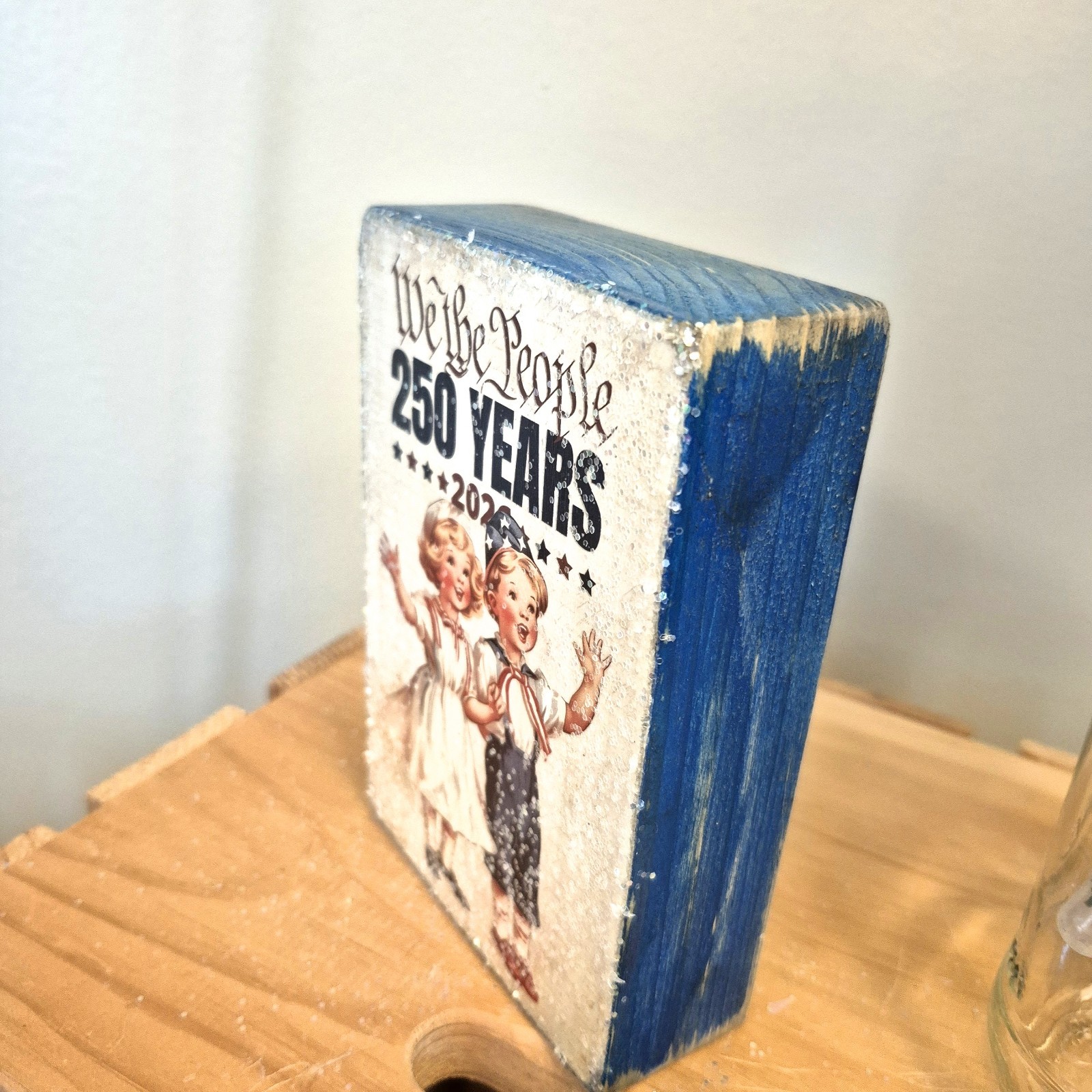 Celebrate 250 Years With Patriotic Boy & Girl On Distressed Blue Wooden Block