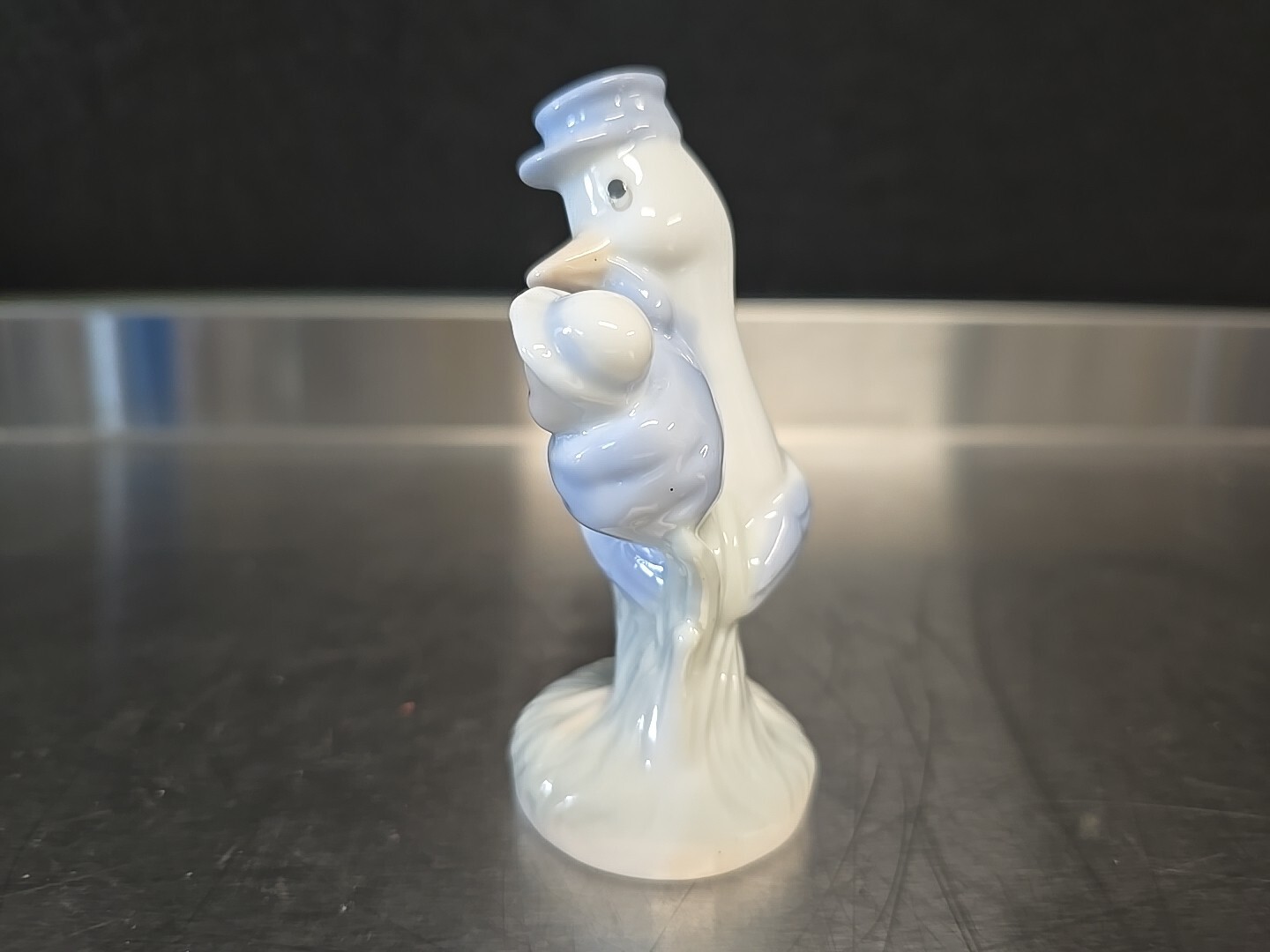 Vintage Porcelain Bird Stork Carrying Baby Infant Figurine