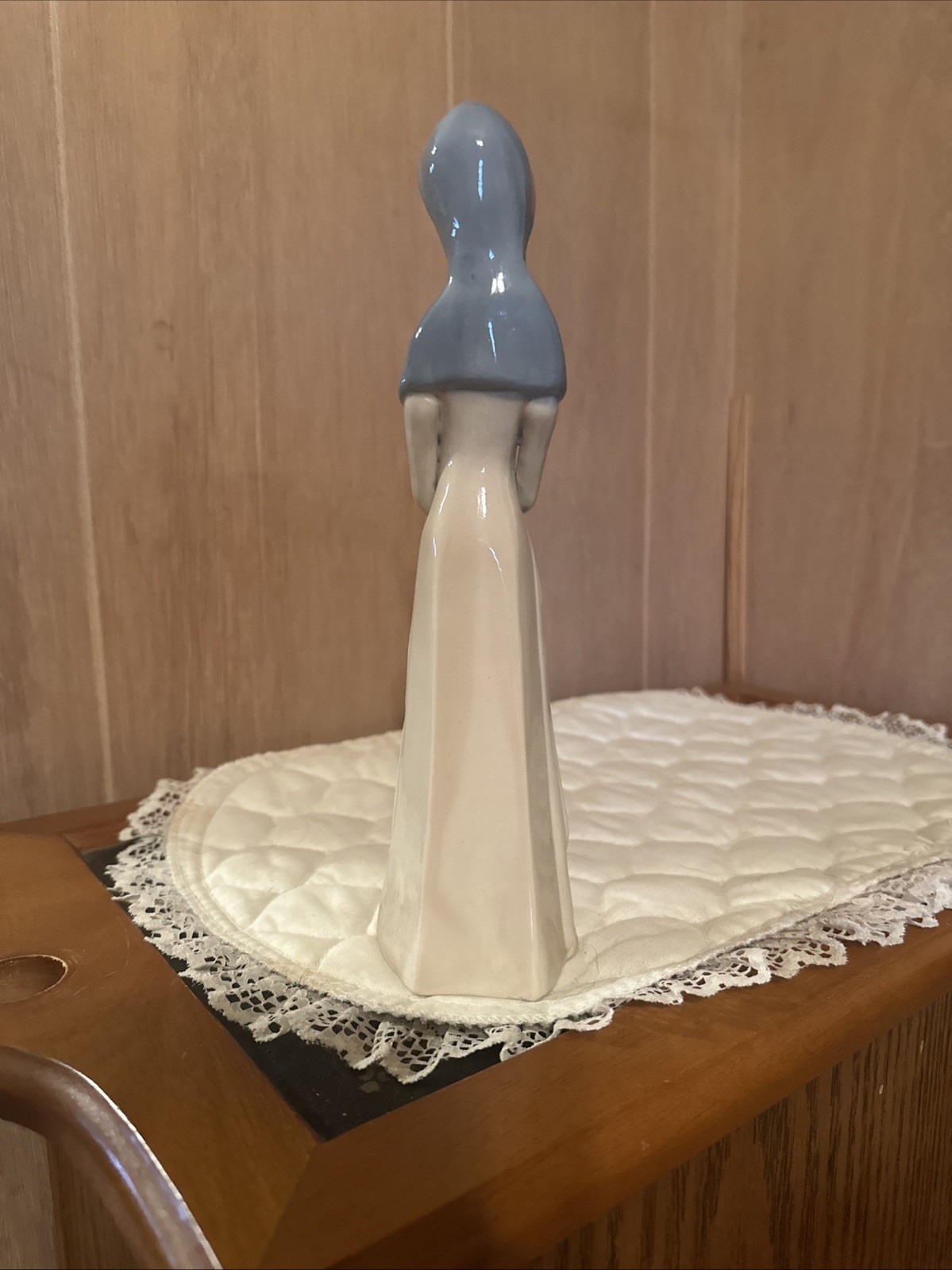 Woman figurine porcelain village lady holding basket Unsigned Vintage
