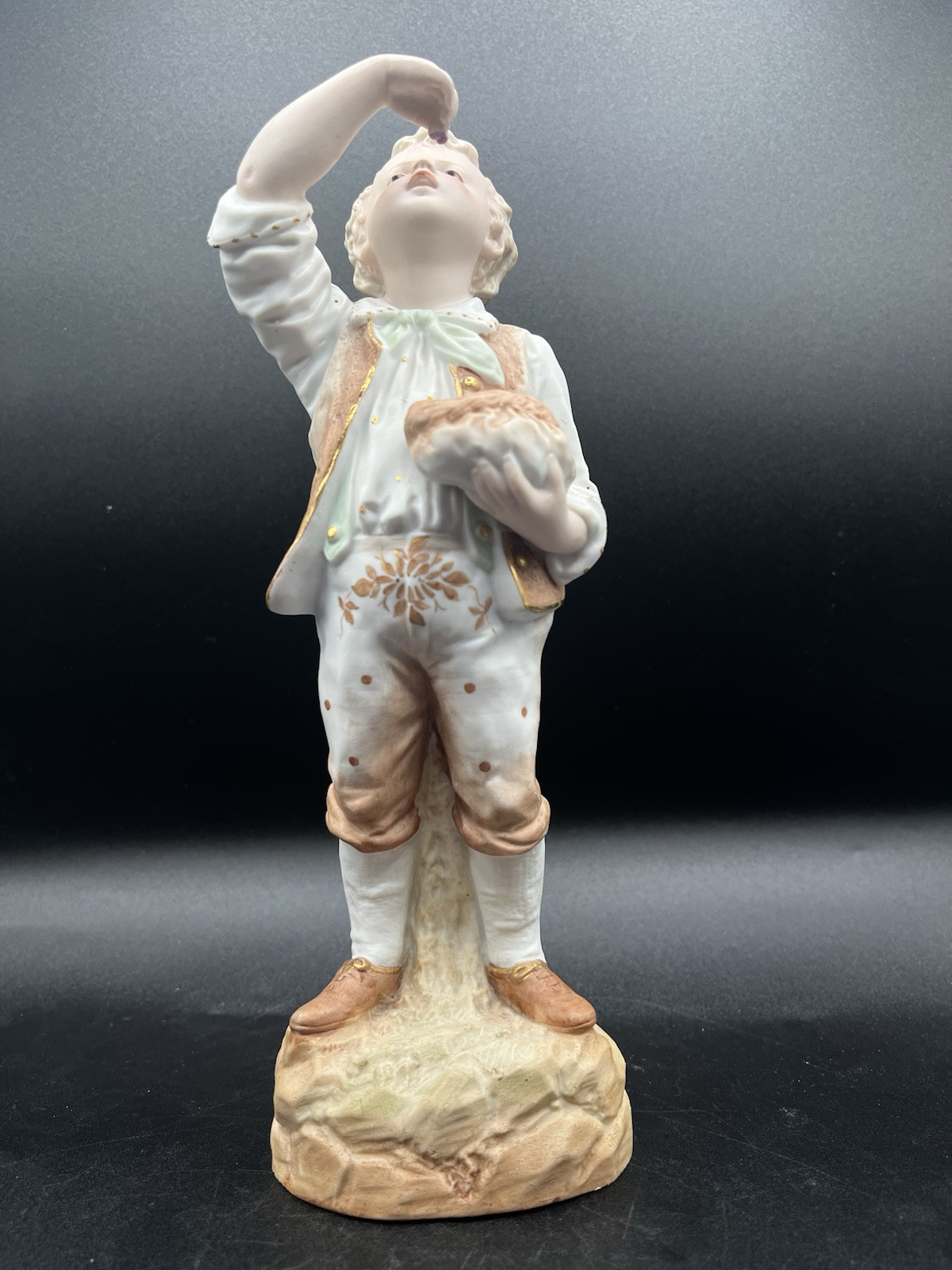 Gebruder Heubach-German Bisque-Young Boy Eating From His Bag Of Goodies