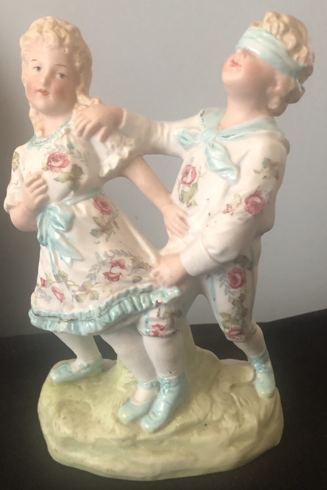 German Heubach Bisque Blind Man’s Bluff Figurine Painted Red Roses 7 3/4