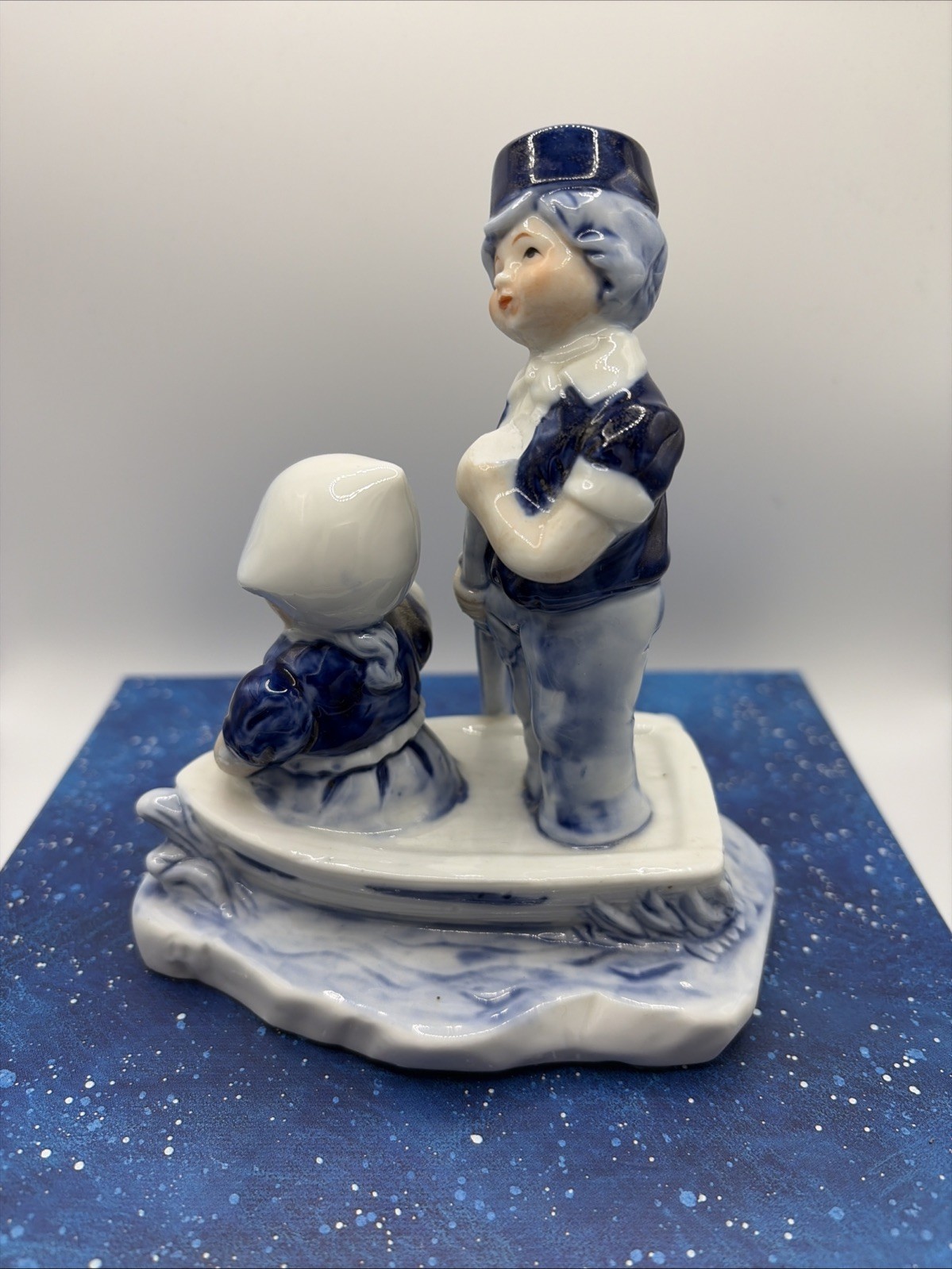 “Dutch Boy Rowing, Girl & Pup: Vintage Holland Souvenir Figurine”