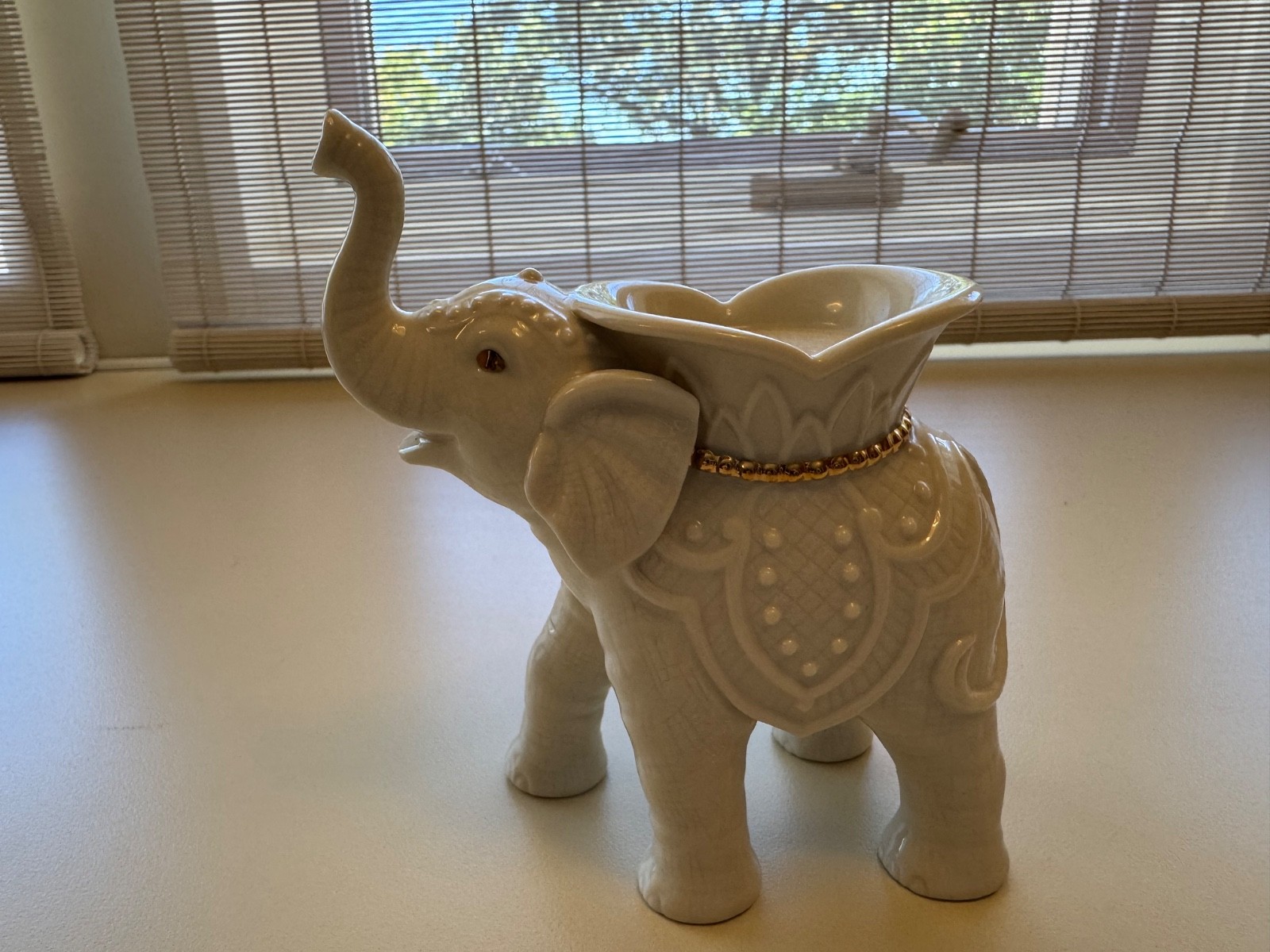 Lenox porcelain trio of animal figurines Elephant gold trim and 2 swans.