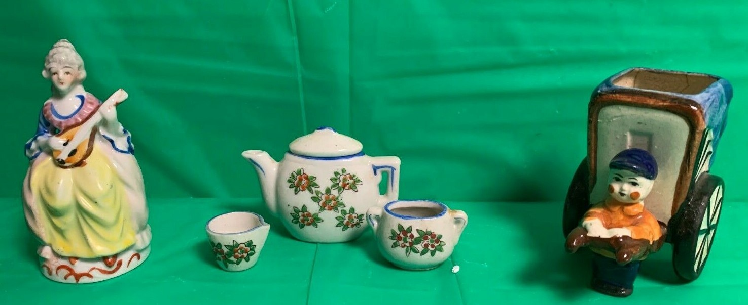 items from Occupied Japan – woman figure, mini tea set and man figure