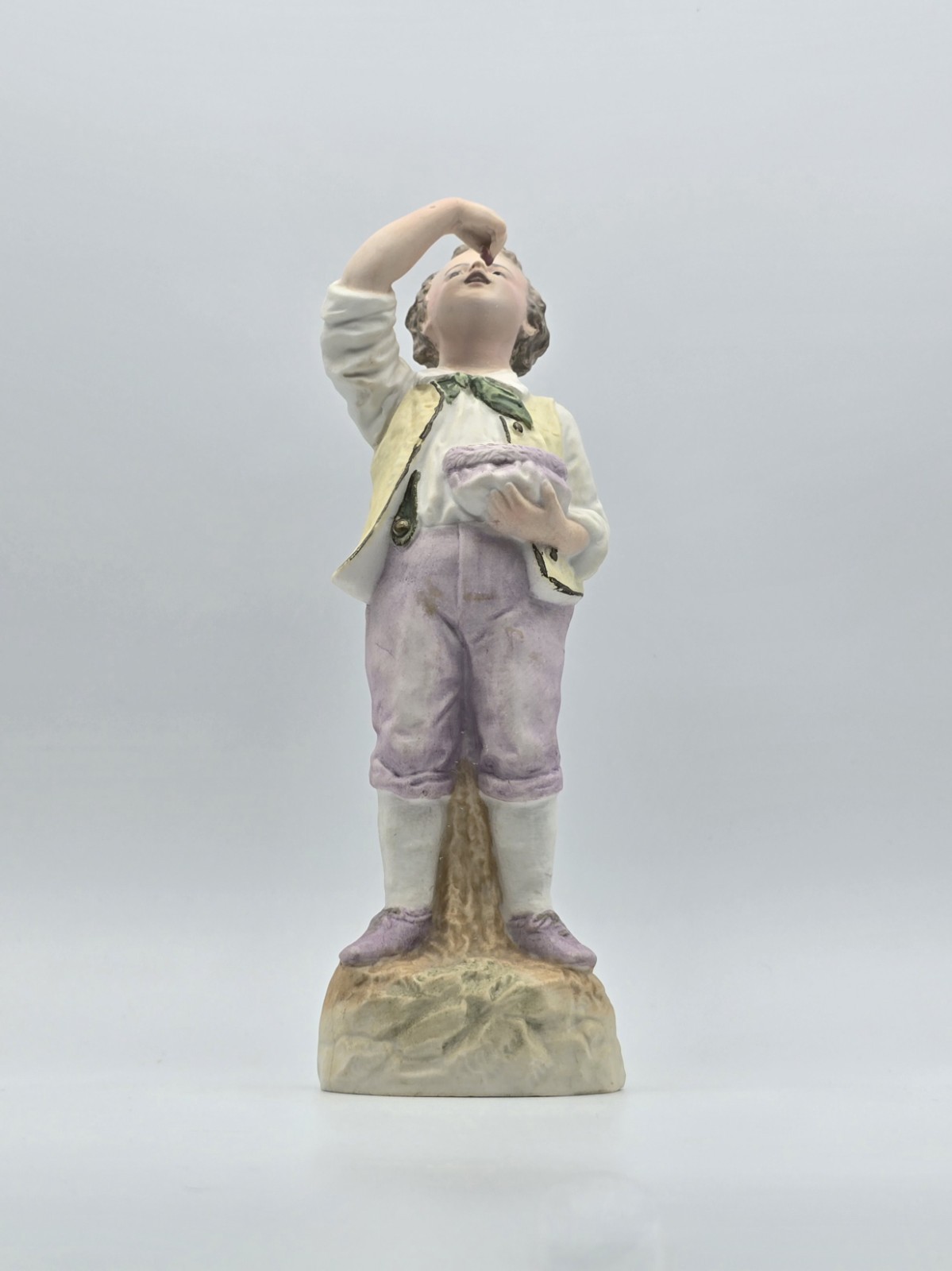 Vintage Gebruder Heubach Figurine 10″ Tall. Young Boy Eating Fruit From His Bag