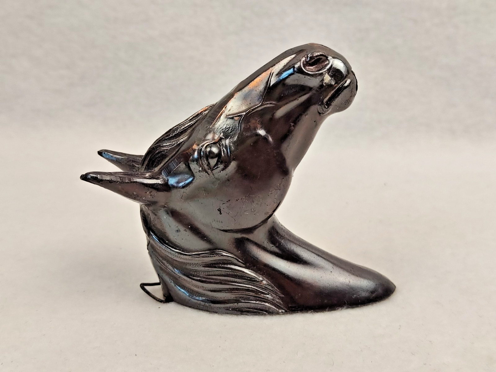 A decorative wall sculpture in the shape of a horse’s head
