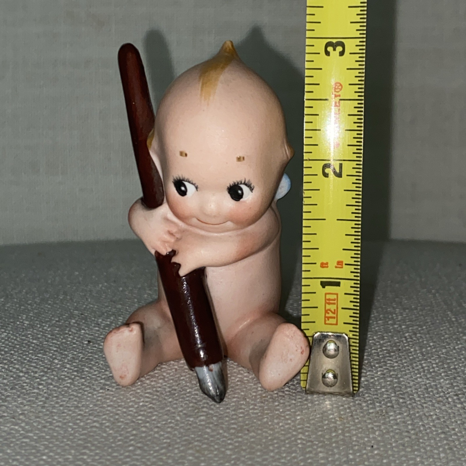 Antique Rare Rose O’Neil porcelain Kewpie Doll Holding Pen ex condition 3″