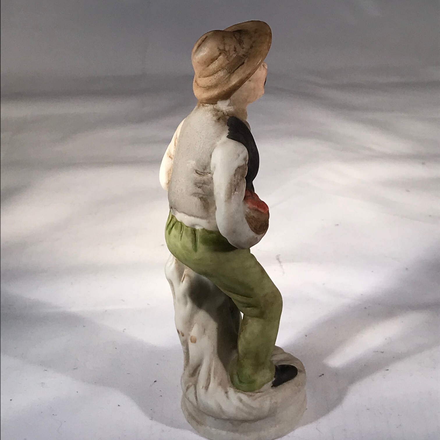 Flambro Fine Porcelain Figurine Man Vest Hat Basket Produce 5 3/4 Inches Tall