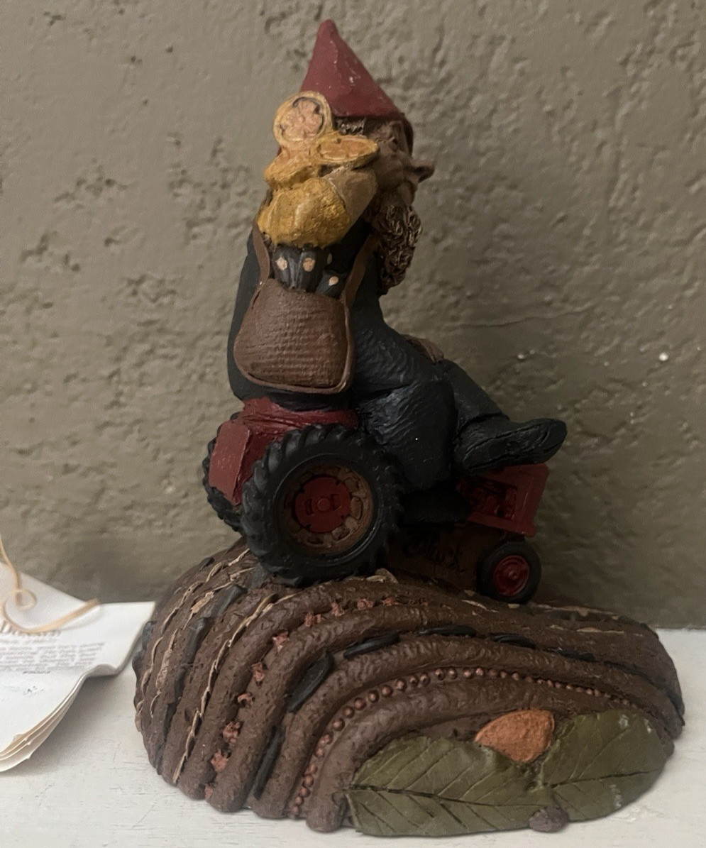 CAIRN STUDIO TOM CLARK GNOME “MACDONALD” ON TRACTOR IN FIELD #67 – 1987