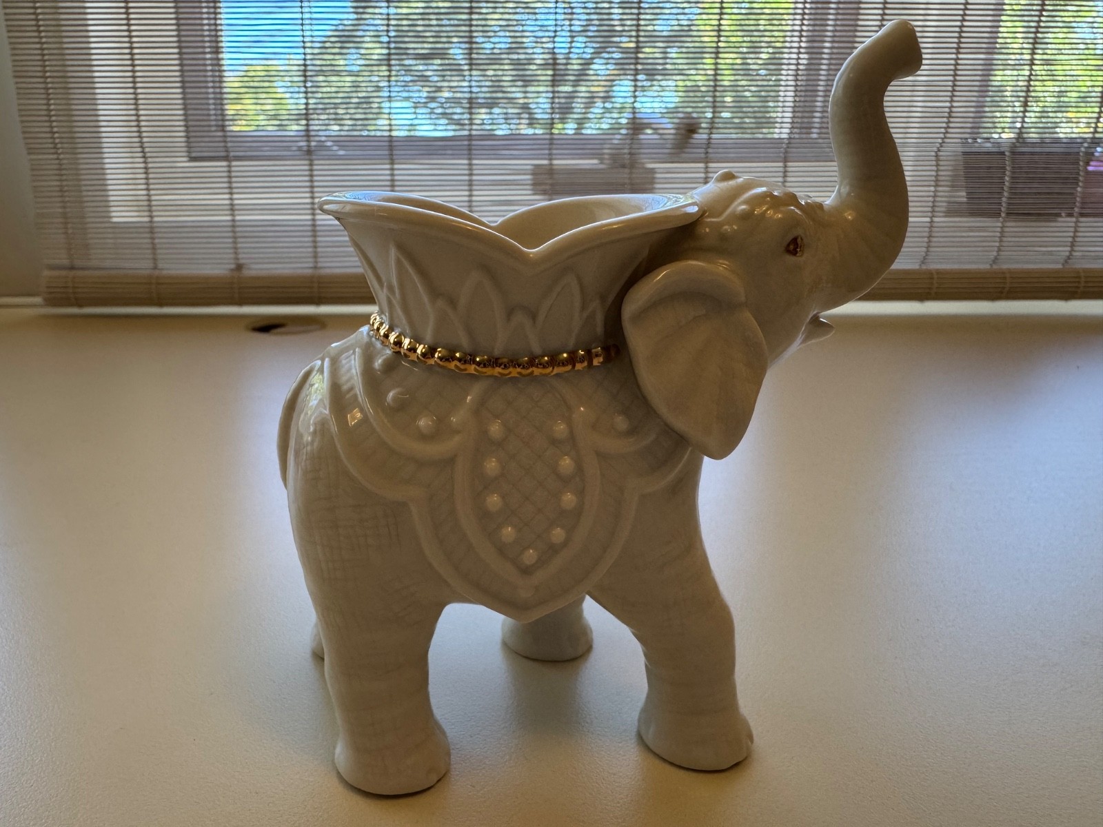 Lenox porcelain trio of animal figurines Elephant gold trim and 2 swans.
