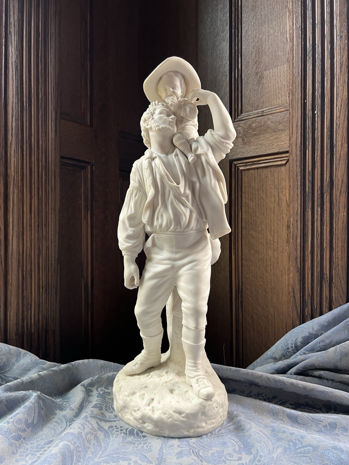 Vintage Bisque Porcelain Figure of a Man Holding his Son on his Shoulder