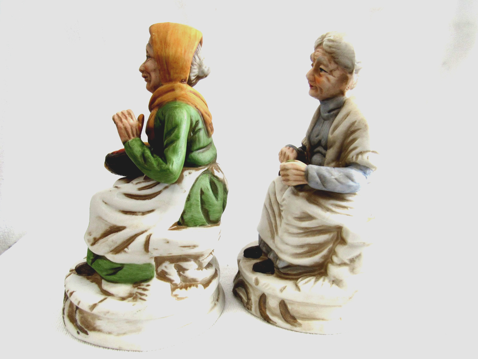 2 Old Women Sitting Holding Vegetable Baskets Figurines