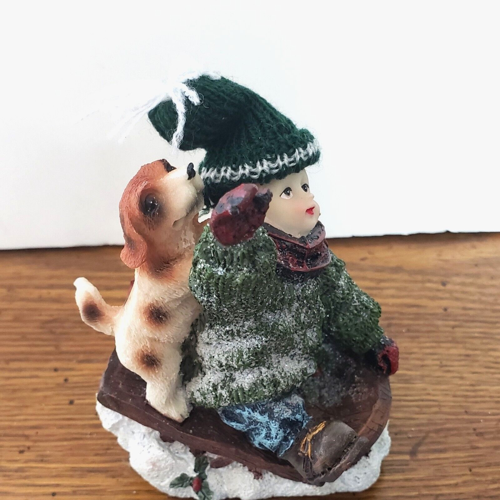 Boy Sledding with Dog Resin Figurine with a Real Knitted Stocking Cap 4″ Tall
