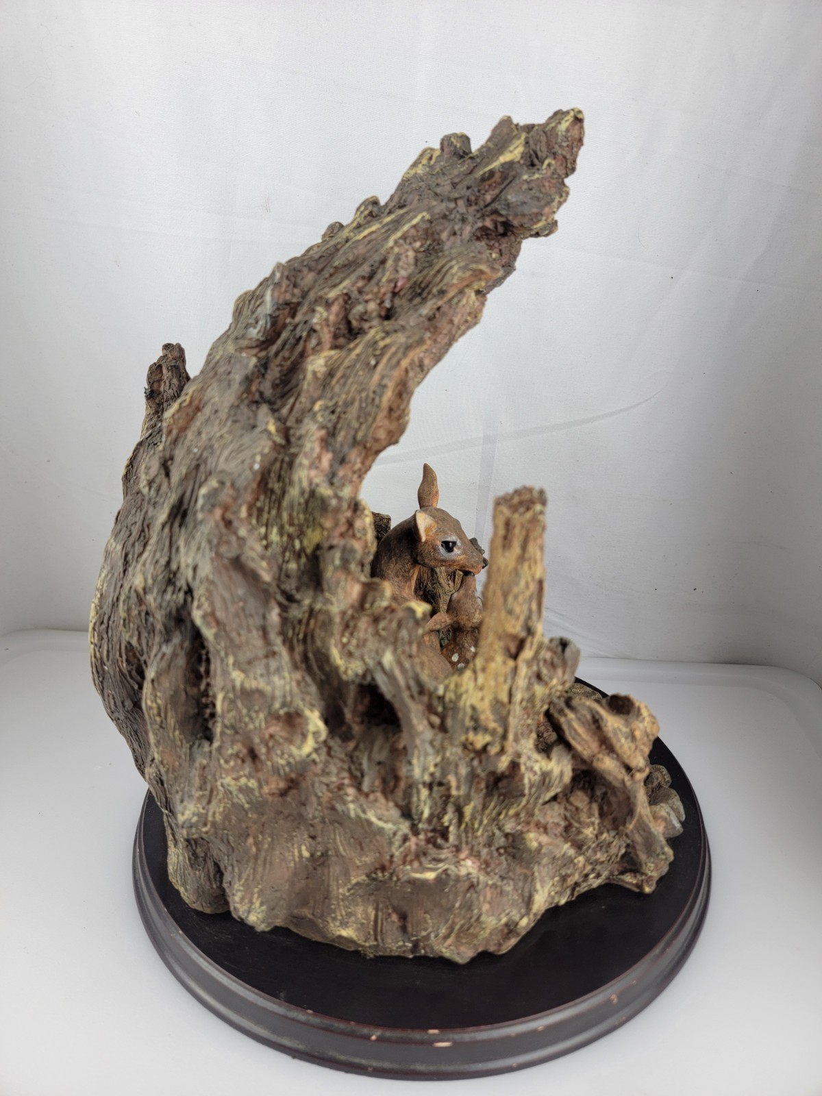 12″ Masterpiece Resin Deer, Fawn Resting Cave/ Tree Trunk Wodeen Base
