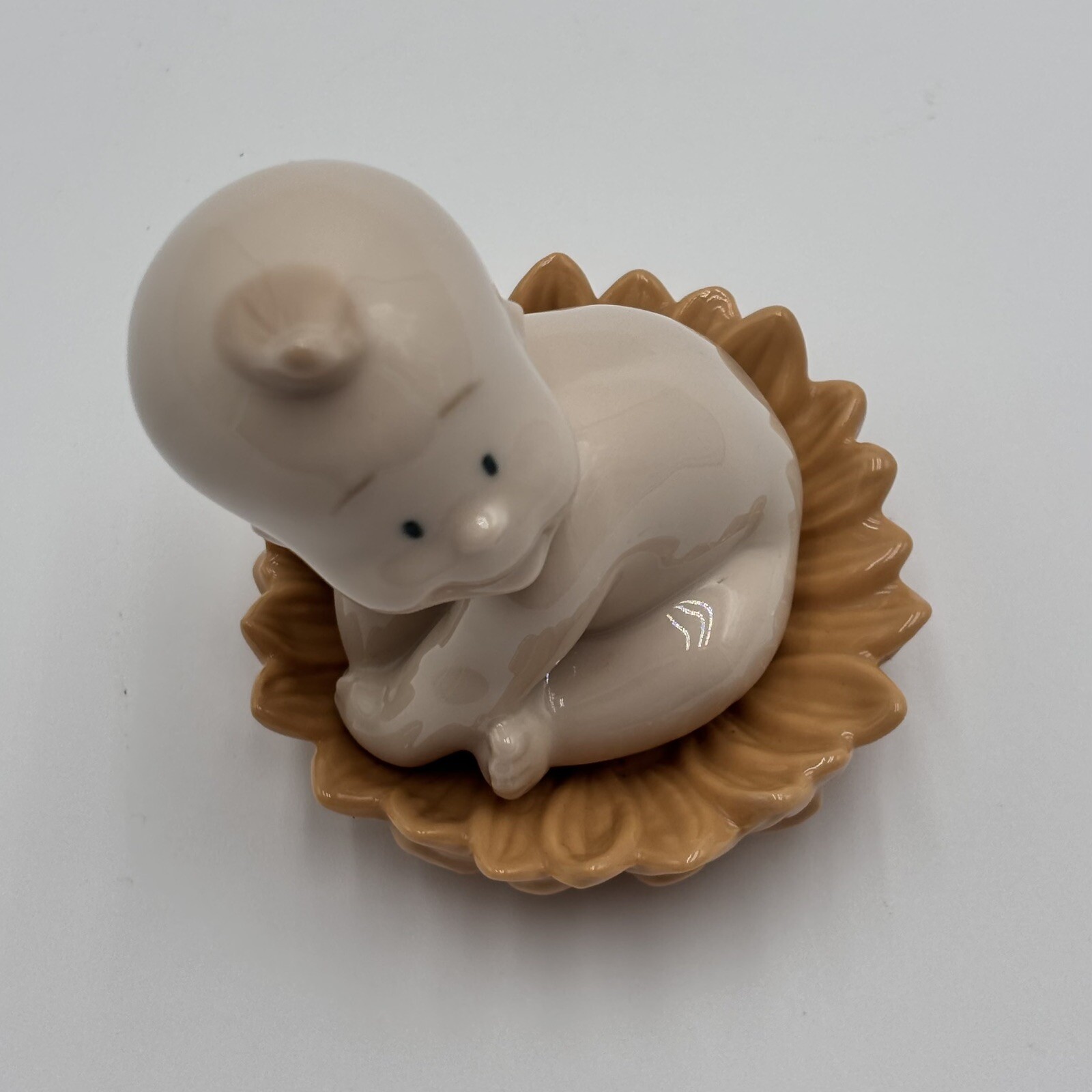 NAO By Lladro 2003 Where do babies come from…Sunflower Porcelain Baby Figurine