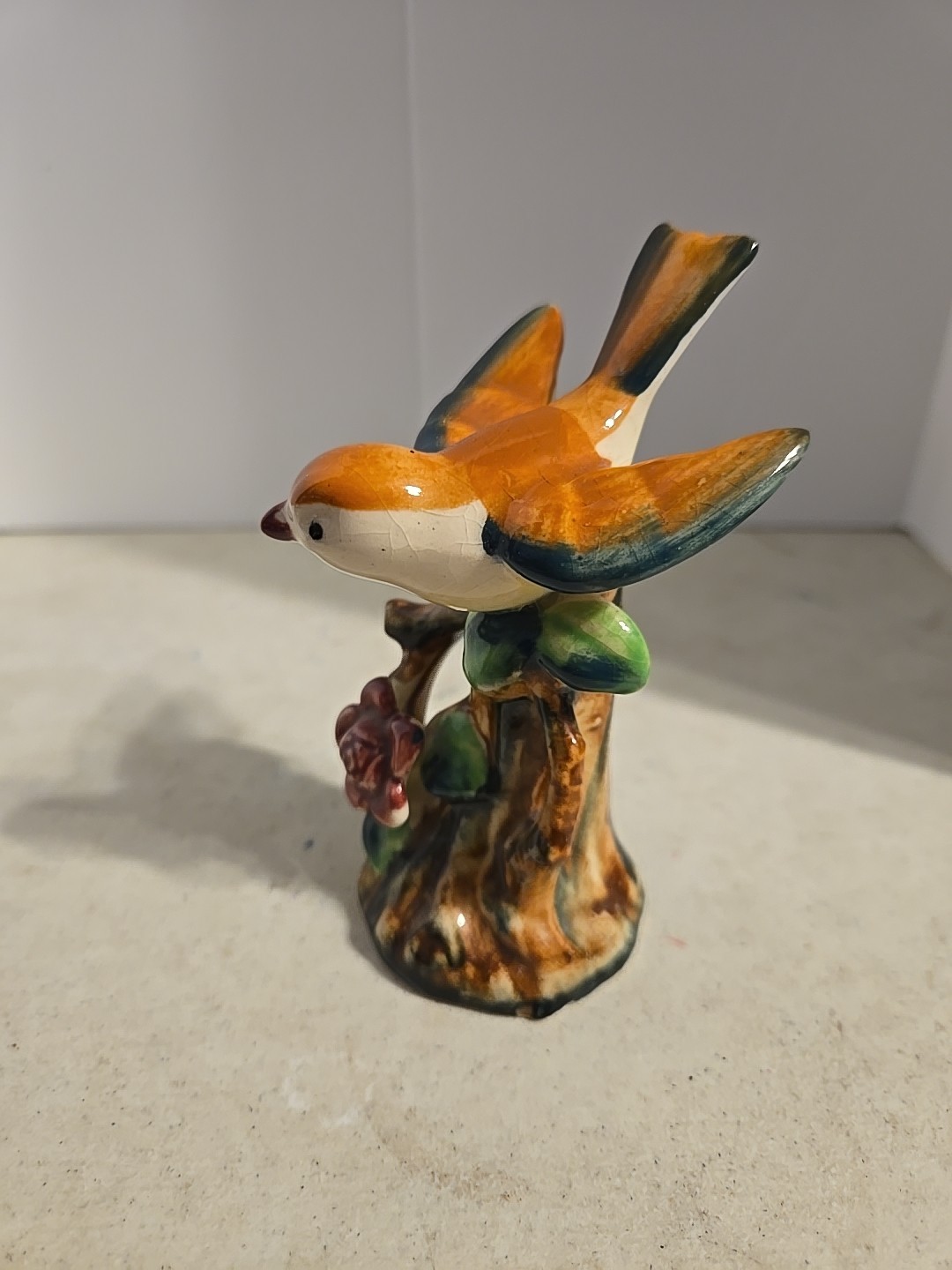 Vintage made in Japan bird figurine perched on tree with flower-collectible!