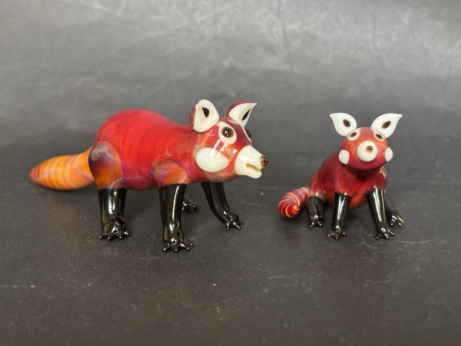 Suellen Fowler Two Glass Red Panda Figurines