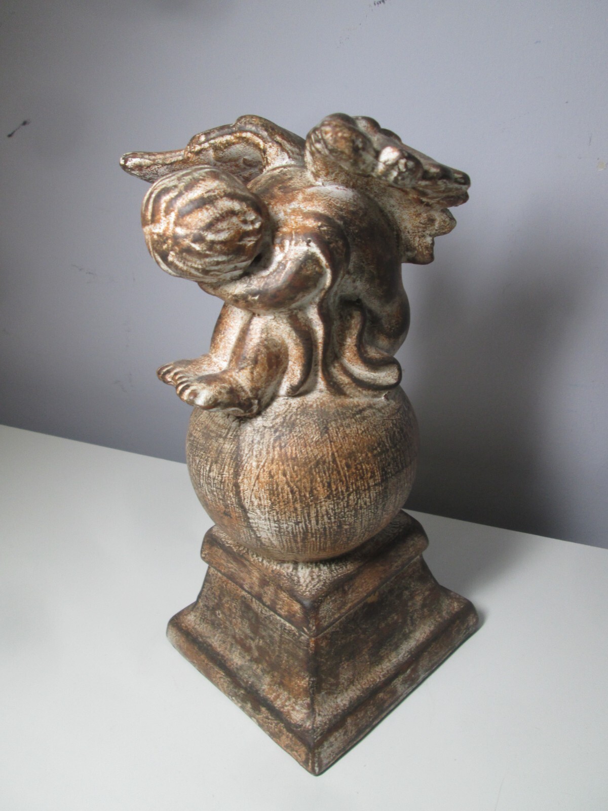 Ceramic Cherub on a Globe inside or outside Décor
