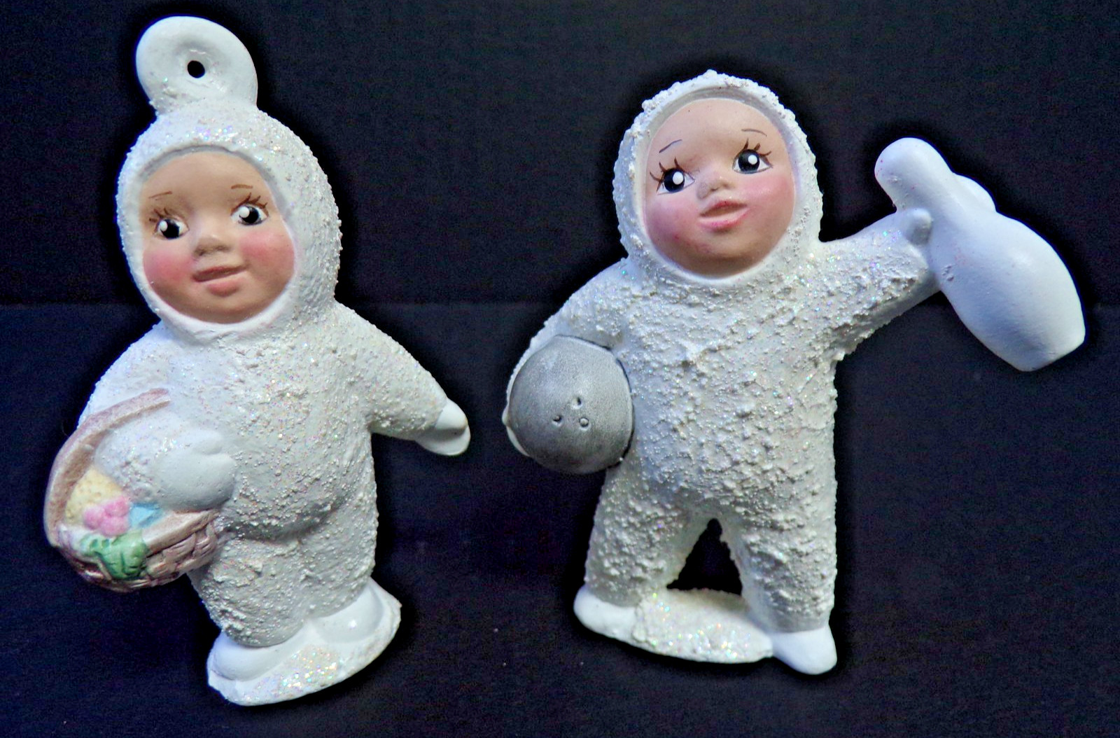 2 WHITE CERAMIC 2005 FIGURINES ONE WITH BOWLING BALL & PIN + ONE WITH A BASKET