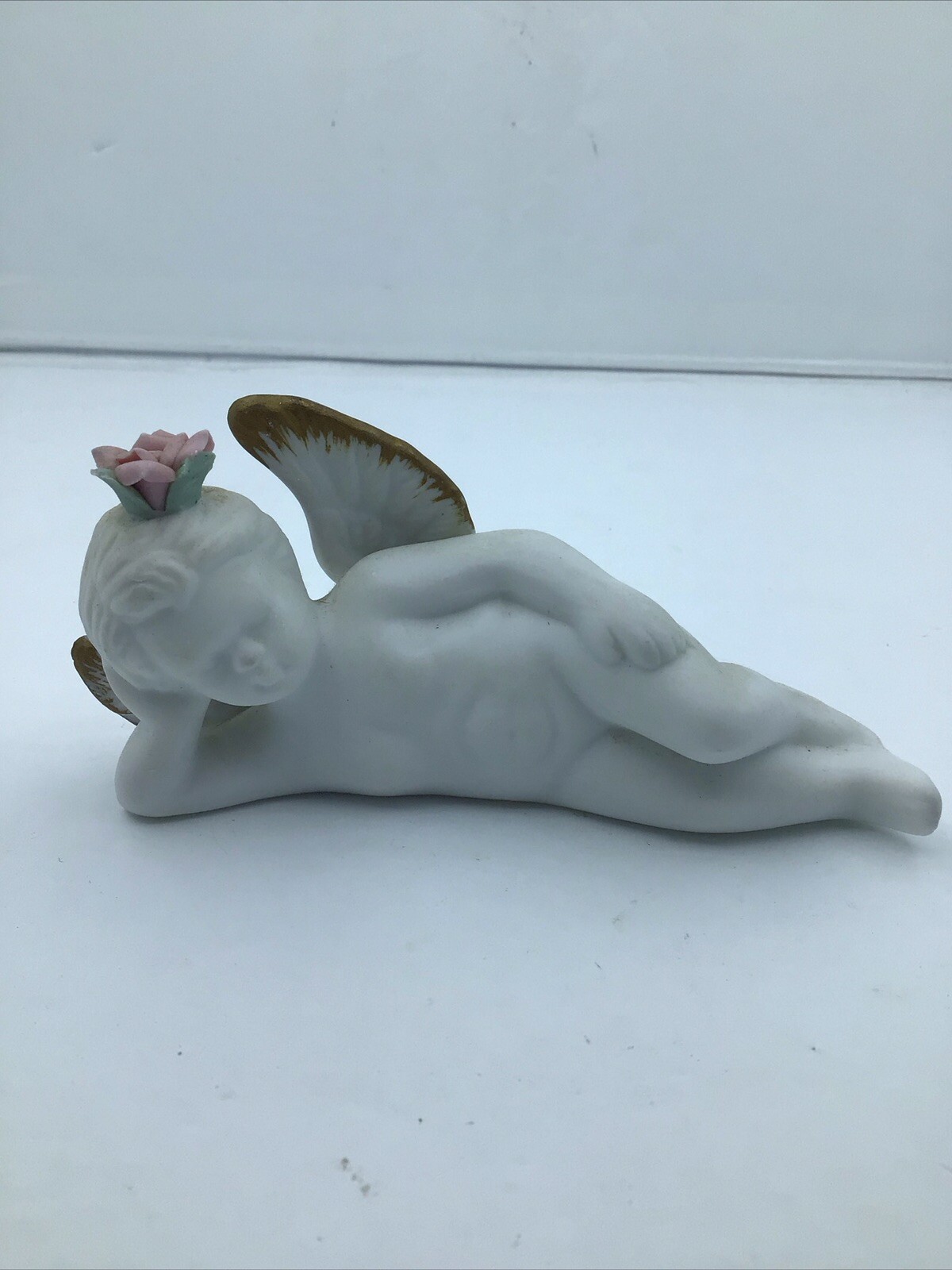 Ceramic Bisque Reclining Angel With Pink Rose Golden Wing Detail