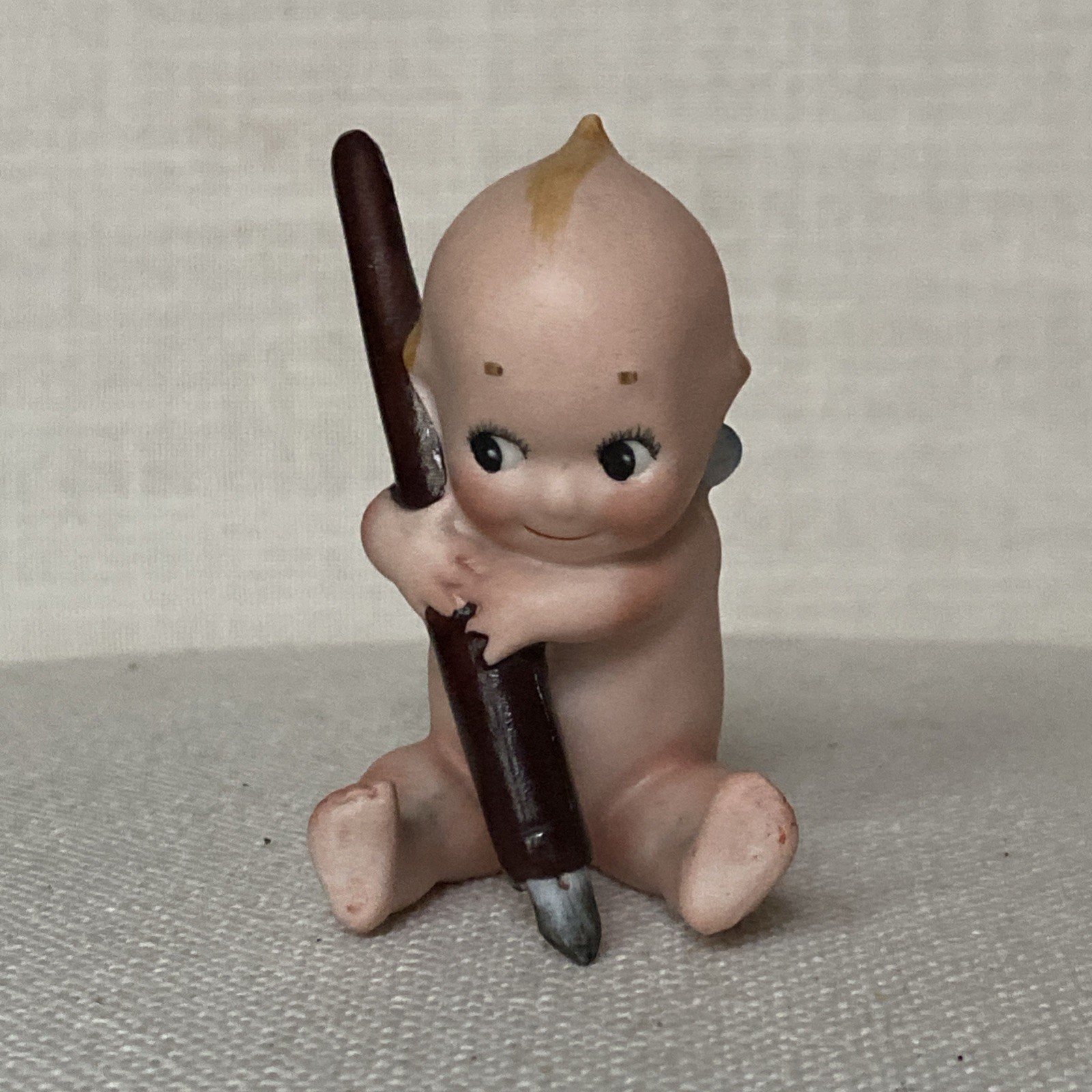 Antique Rare Rose O’Neil porcelain Kewpie Doll Holding Pen ex condition 3″