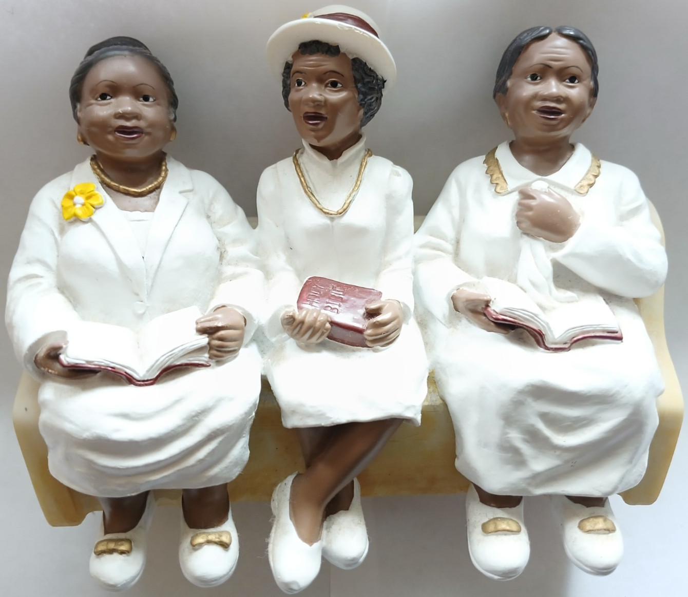 FIGURINE/LADIES IN WHITE SITTING ON A CHURCH PEW WITH THEIR BIBLES-PRE OWNED
