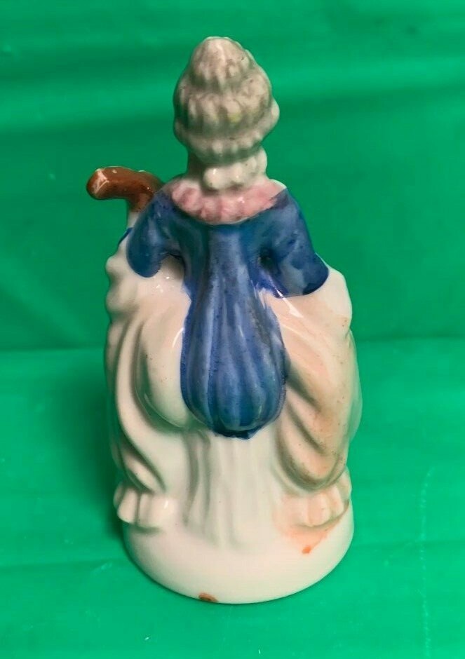 items from Occupied Japan – woman figure, mini tea set and man figure