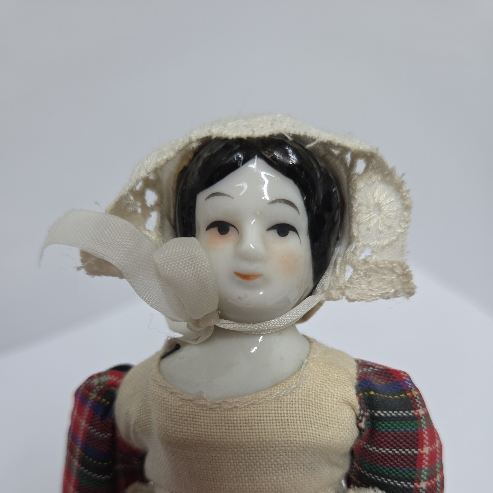Vintage 8″ Porcelain Pilgrim Doll W/ Plaid Dress & White Apron