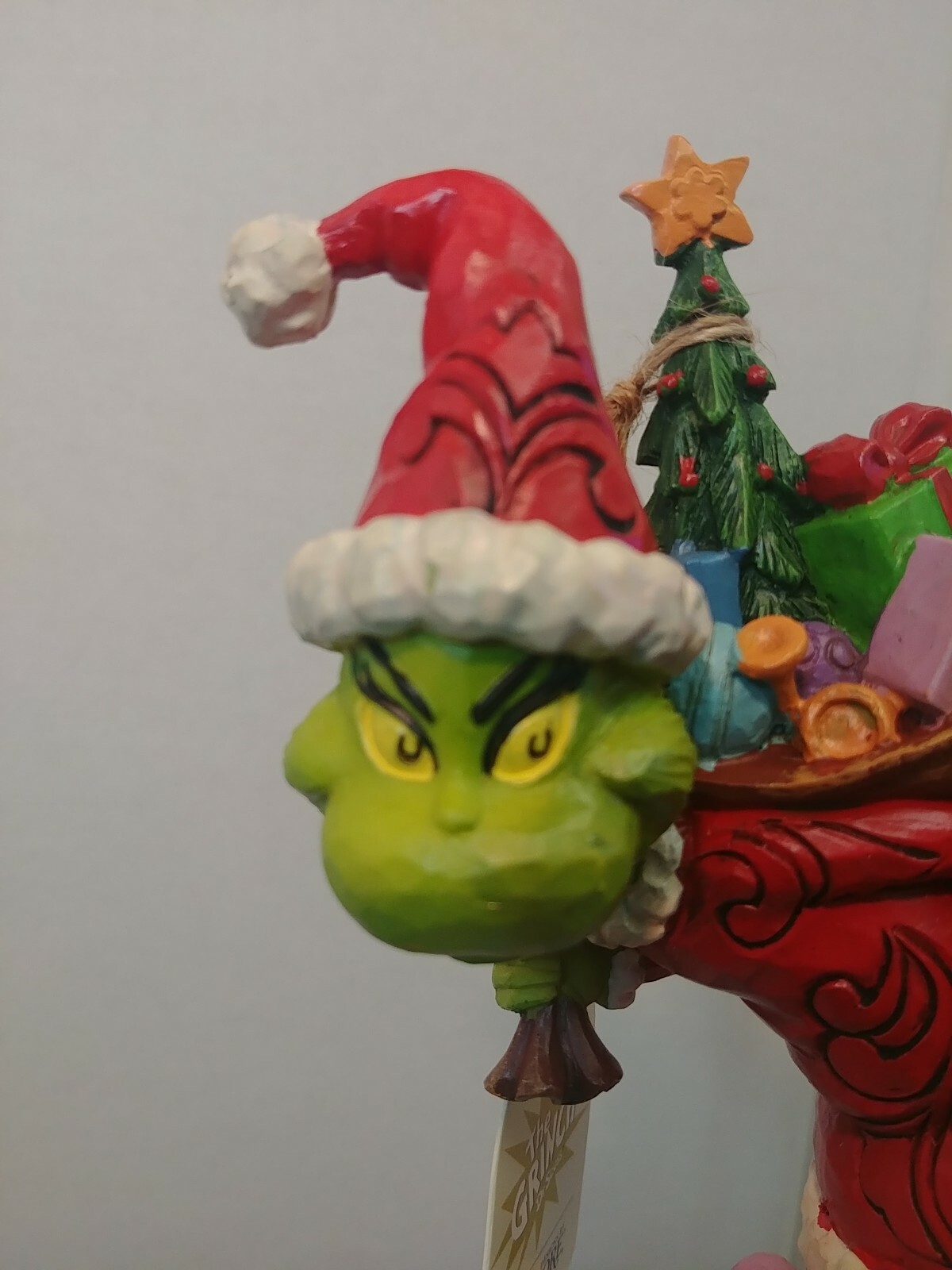 Dr. Seuss Grinch by Jim Shore Grinch Tip Toeing with Bag of Gifts 7.7″ Figurine