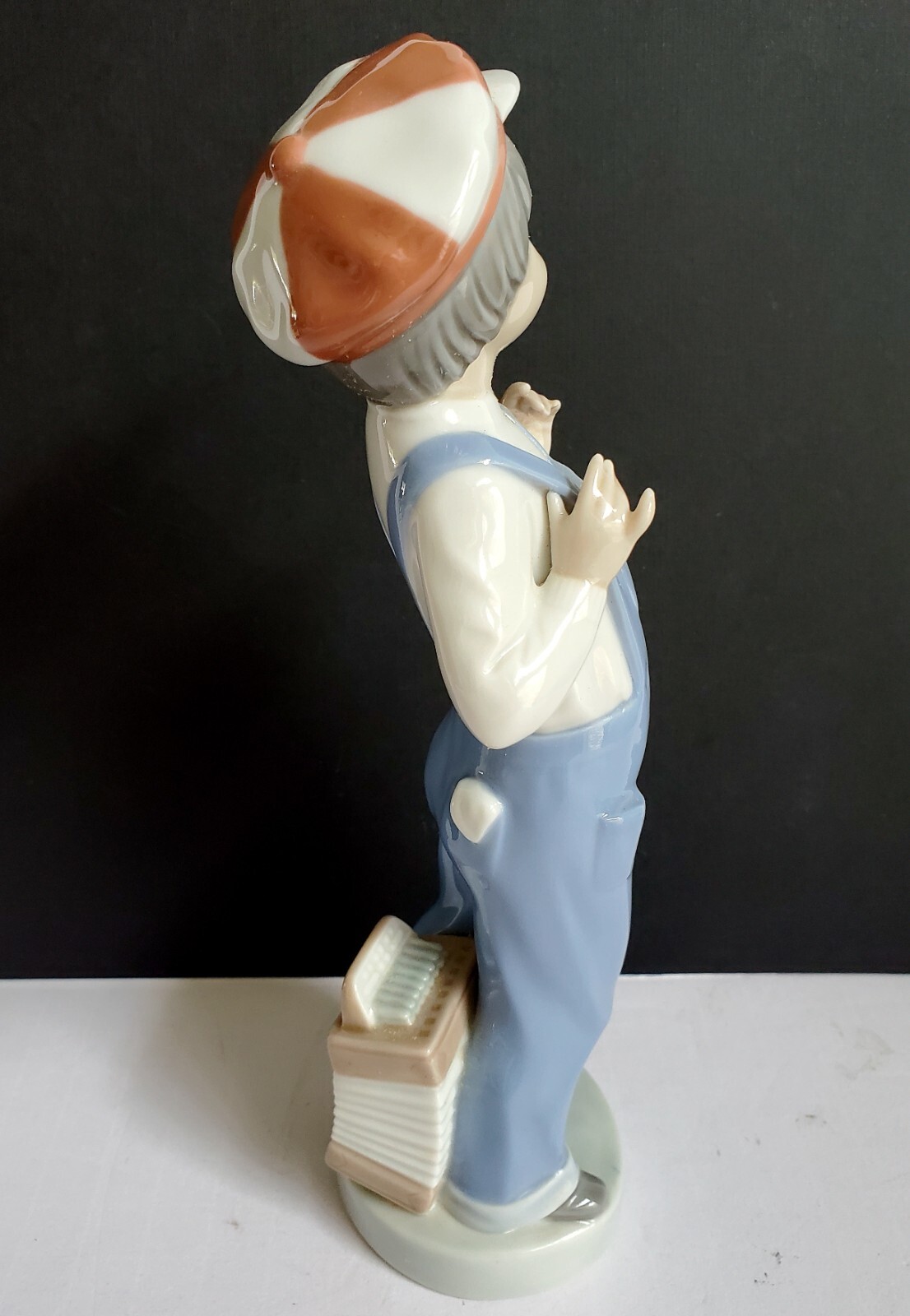 LLADRO Porcelain Boy From Madrid – 8.5″ Boy in Overalls with Accordion #4898