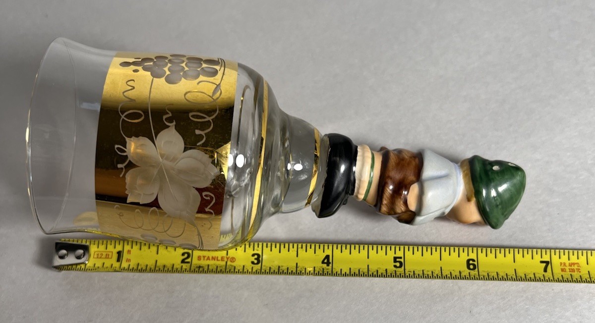 Vintage Goebel crystal bell featuring a porcelain figurine of a young boy on top