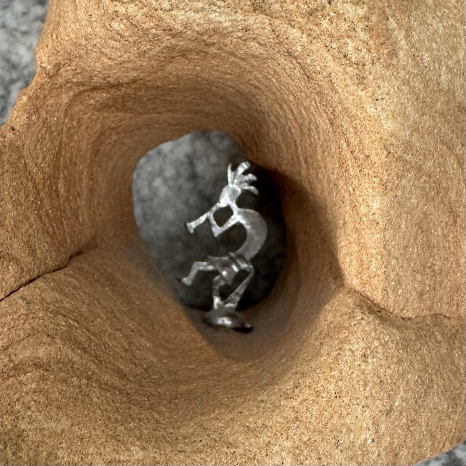 Southwestern Kokopelli Metal Figurine in Natural Sandstone Rock