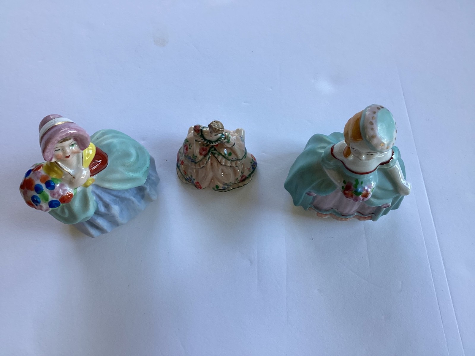 3 Porcelain Figurine Woman W/ Flowers 4 1/8” Tall Vintage Occupied Japan.