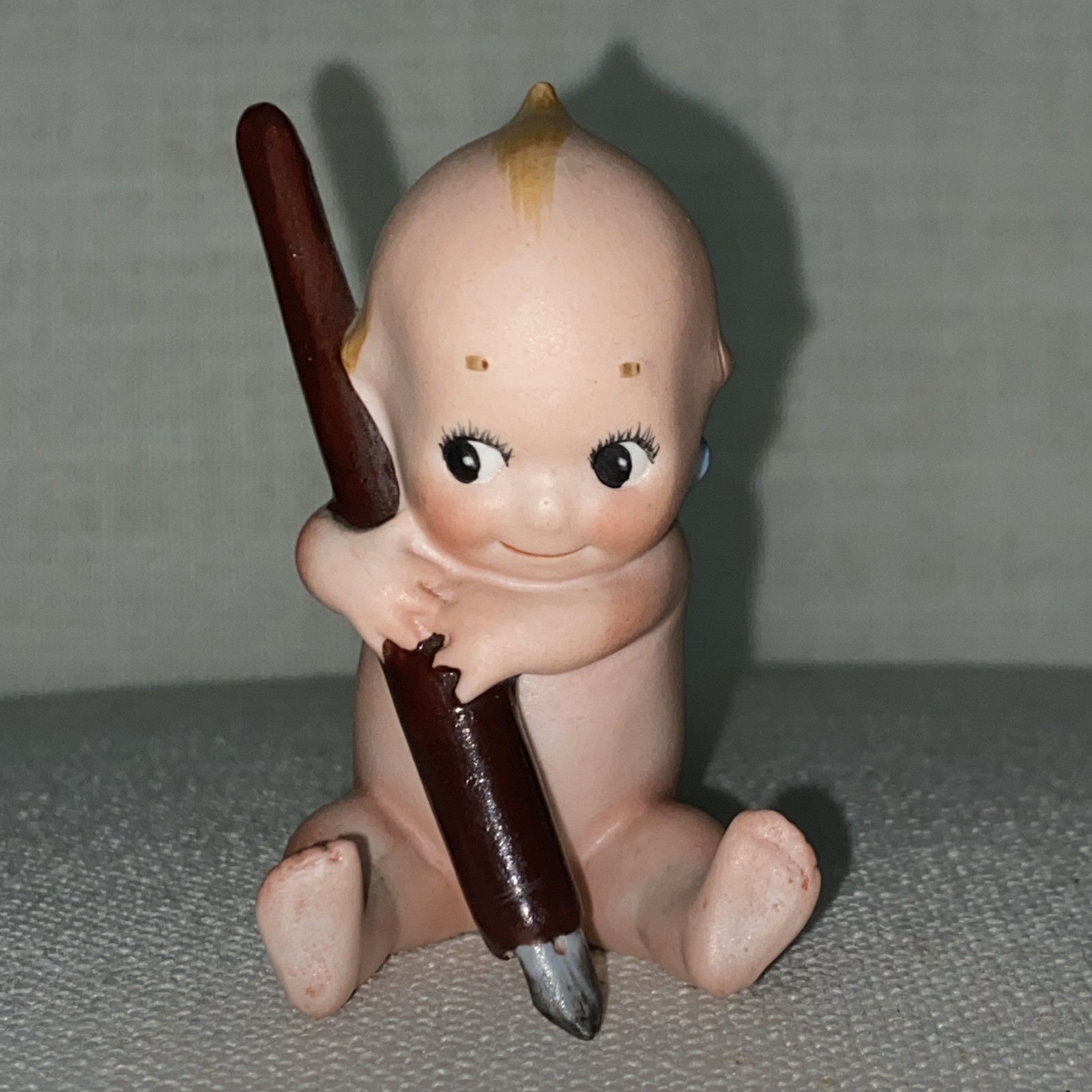 Antique Rare Rose O’Neil porcelain Kewpie Doll Holding Pen ex condition 3″
