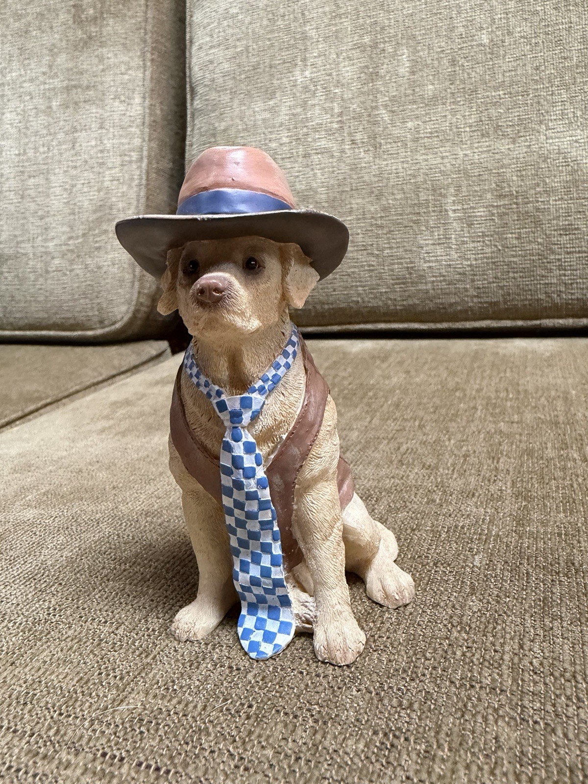 lifelike dog figurine in clothes