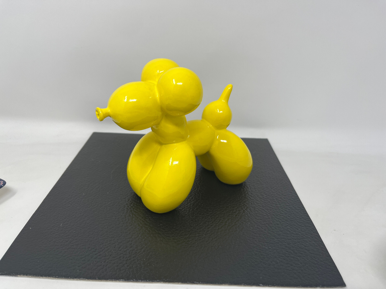 YELLOW CERAMIC RESIN BALLOON DOG FIGURINE- 4.5″ x 6″