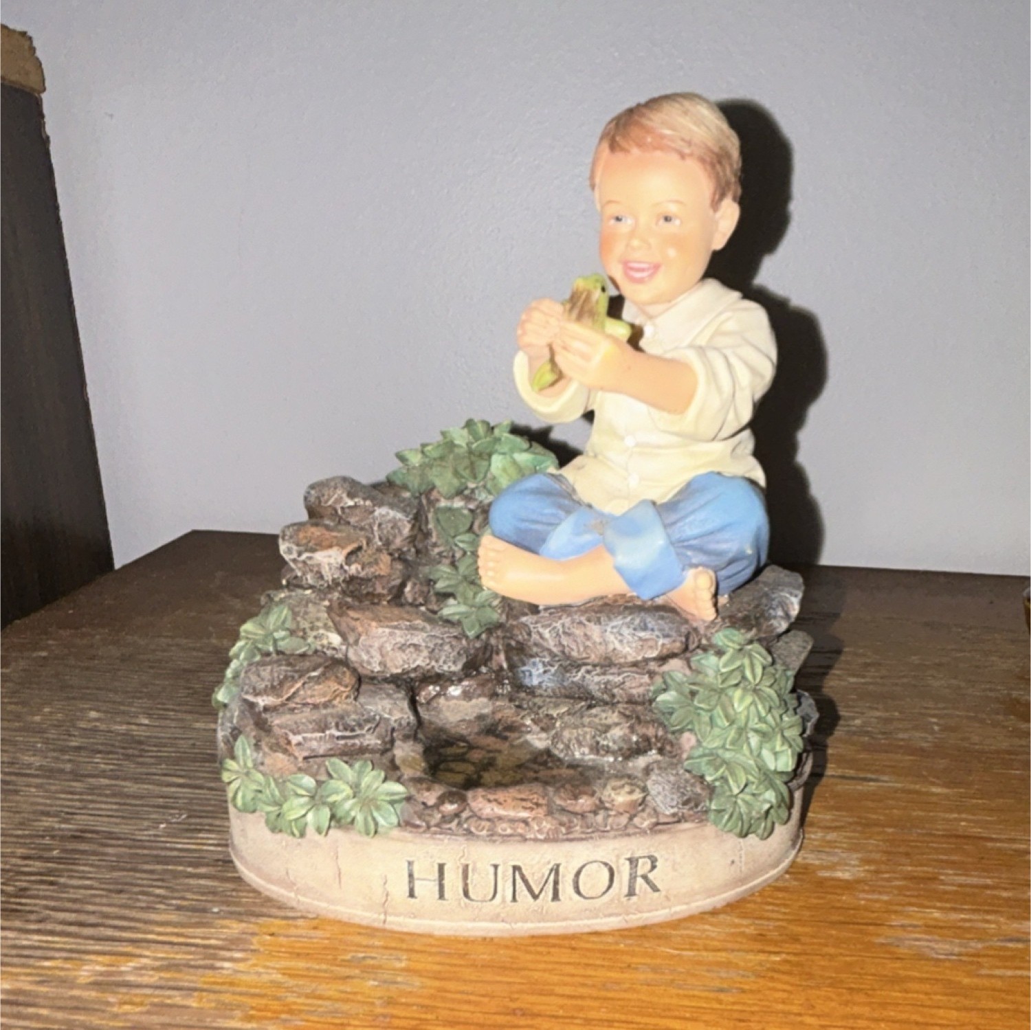 DEMDACO Humor Resin Figurine Painted Child Sitting on Rocks Sculpture