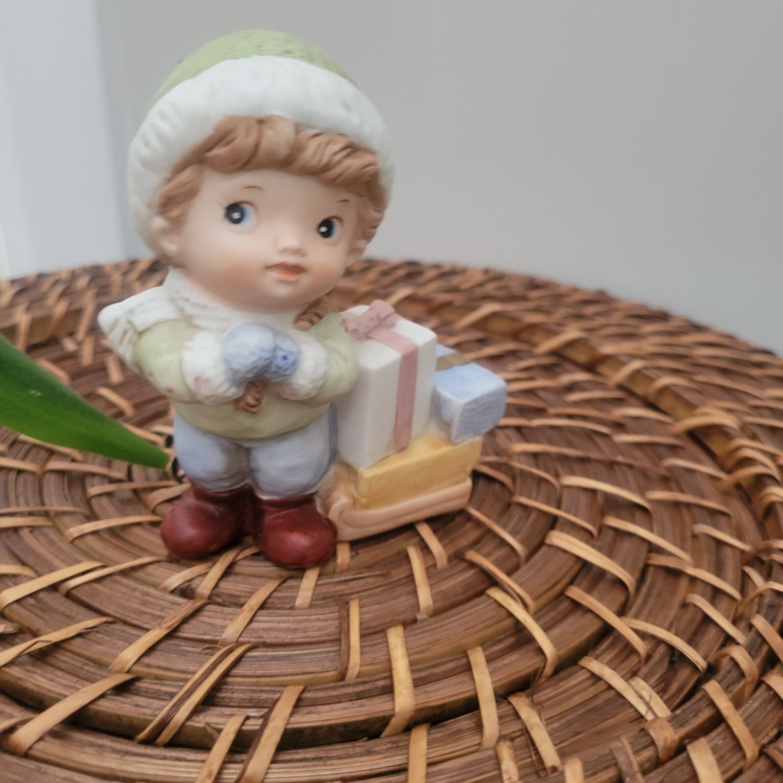 Vintage Homco Bisque Porcelain Figurine #5556 . Boy in Green cap with gifts.
