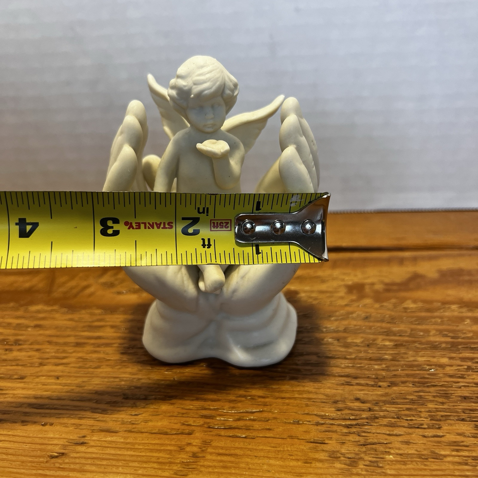 Vintage White Porcelain Figurine~Cherub Angel Sitting in Praying Hands~BEAUTIFUL