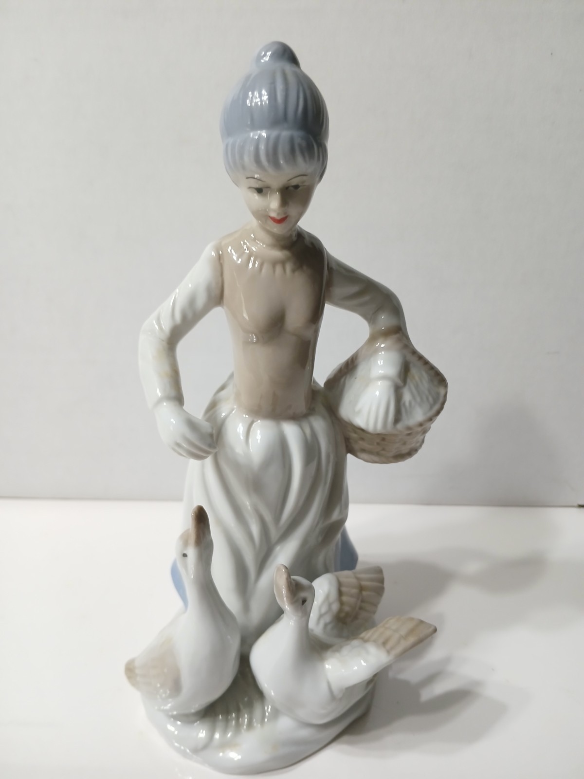 VTG Porcelain Girl With Geese Figurine. 8 1/2″.