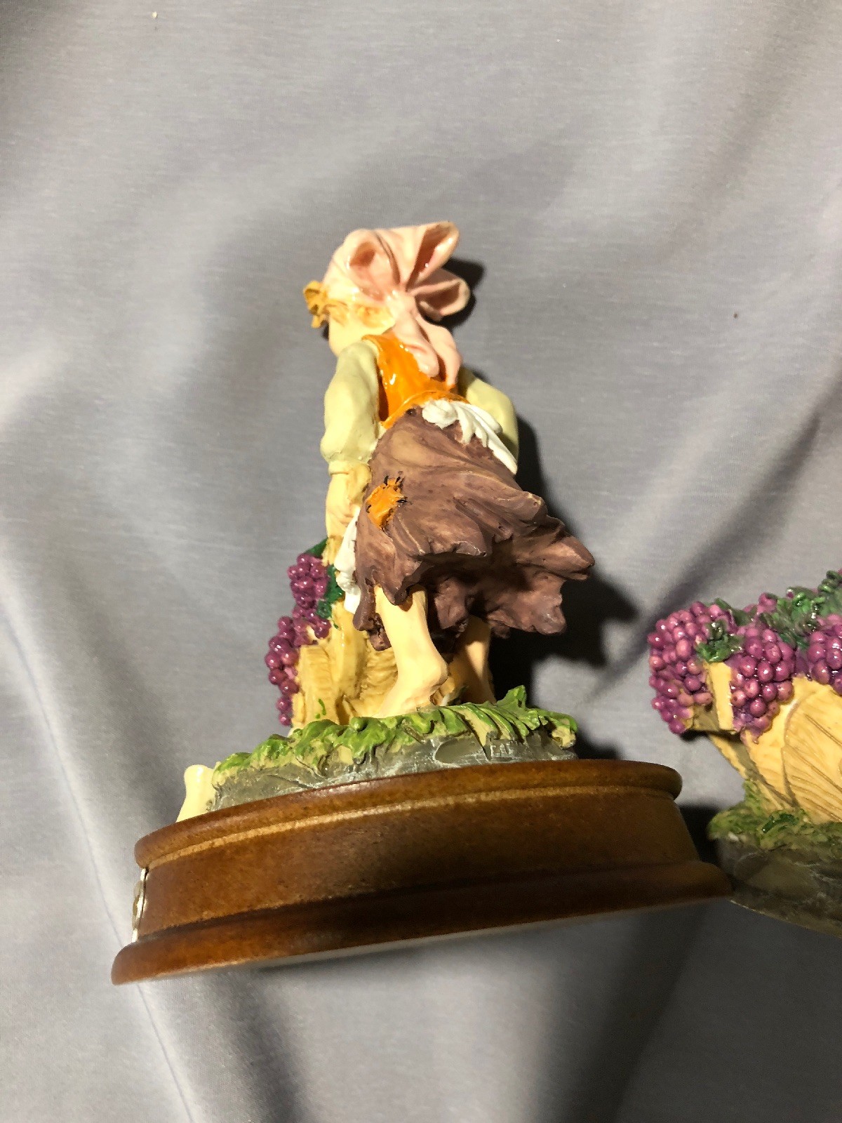 DaVinci Collection – A pair of Figurines – Boy and Girl with grapes in barrows