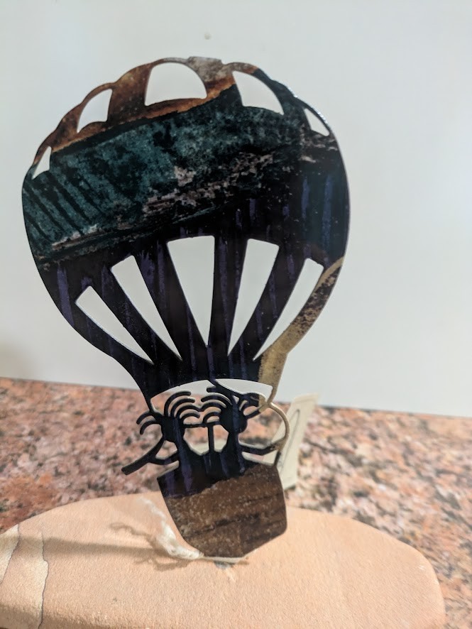 Lazart Kokopelli Hot Air Balloon Petroglyphs Metal Art on Sandstone