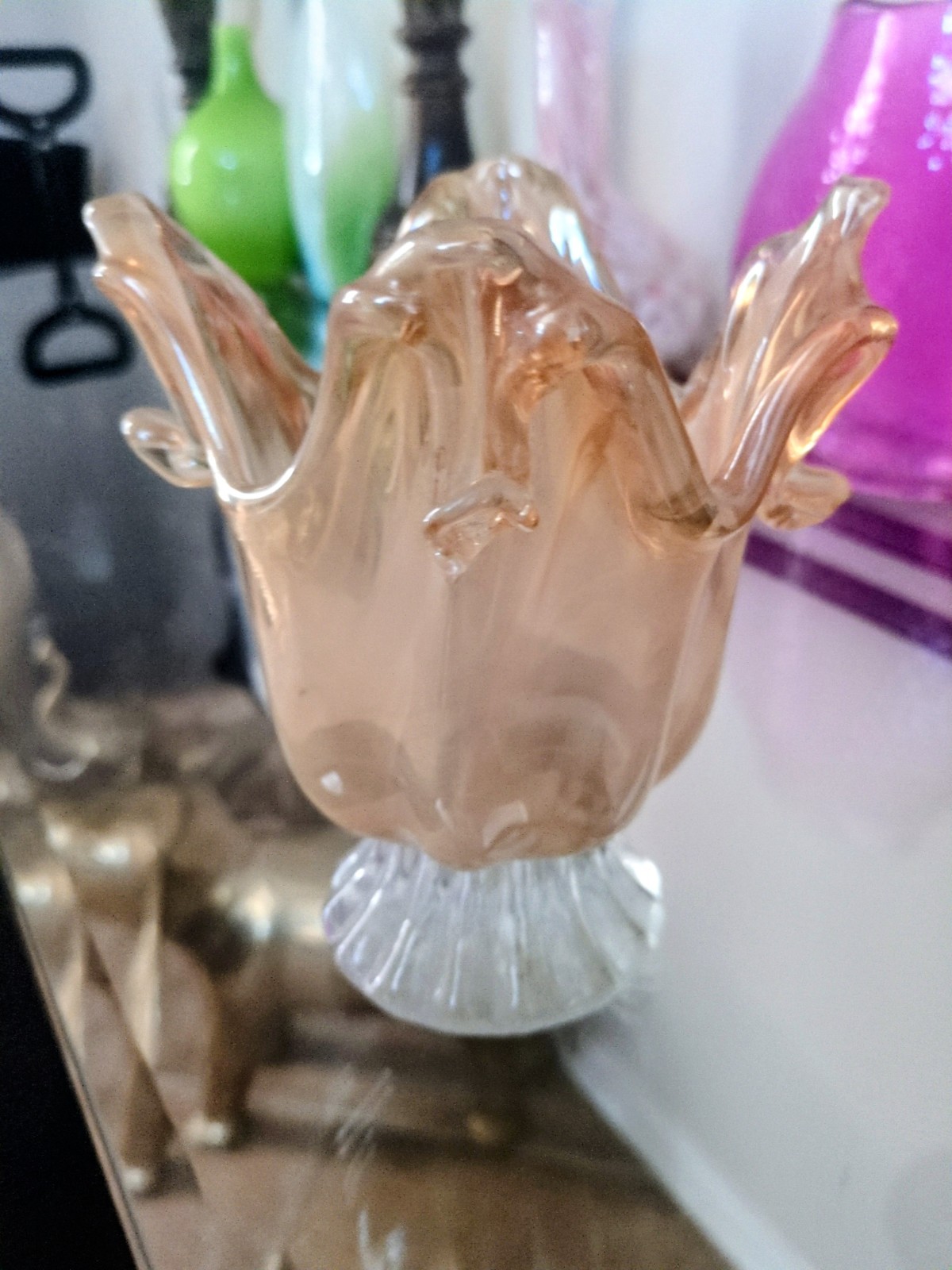 Hand-blown Italian art glass bowl with ruffled rim and iridescent finish. 6″