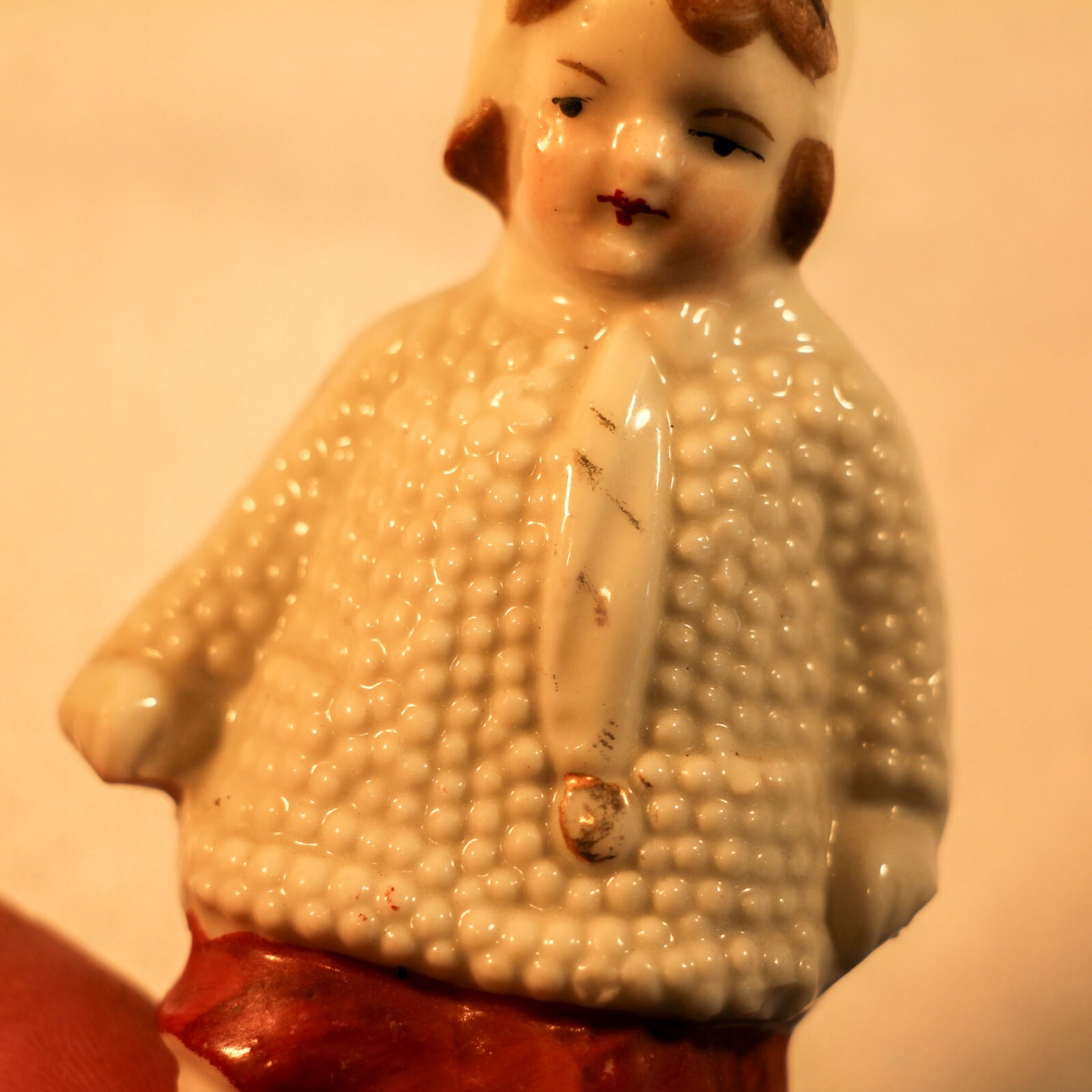 vintage Girl in knit coat porcelain figurine 3.75″ Germany