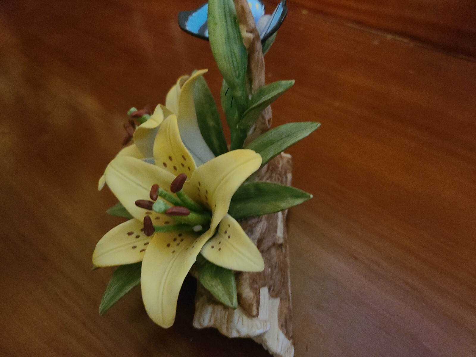 Lilly & Butterfly ceramic small figure on a branch/ flowers, multi colored New