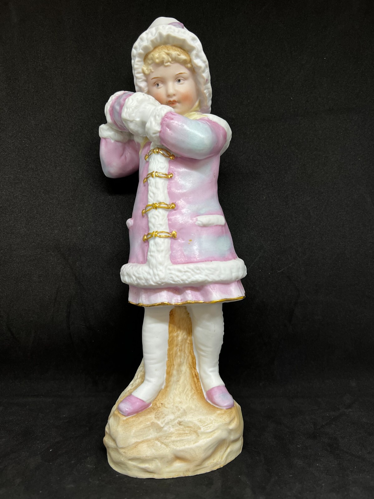 Gebruder Heubach-German Bisque-A Young Woman With Her Hands In Her Muff 11 1/2″