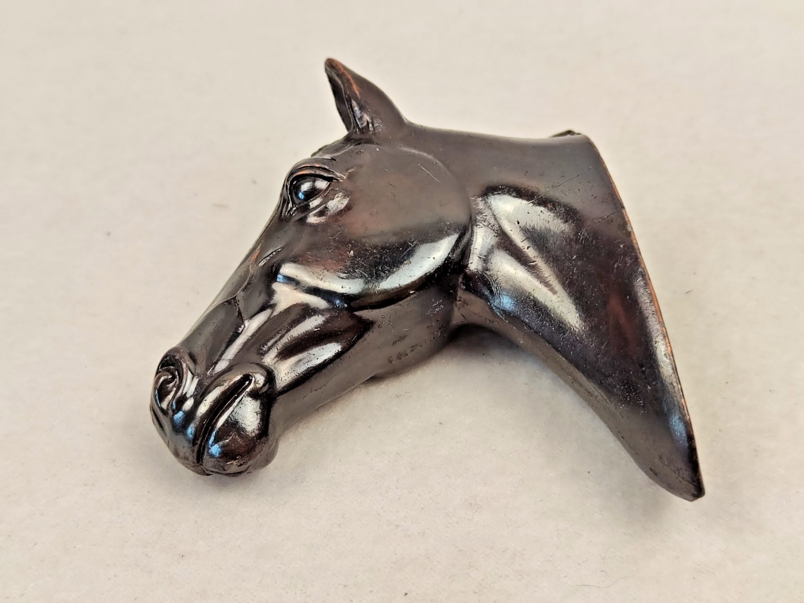 A decorative wall sculpture in the shape of a horse’s head
