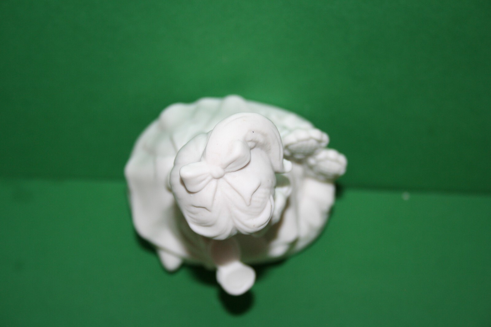 White Bisque Porcelain Girl Figurine Ruffled Dress Bow Powdering Face Flowers