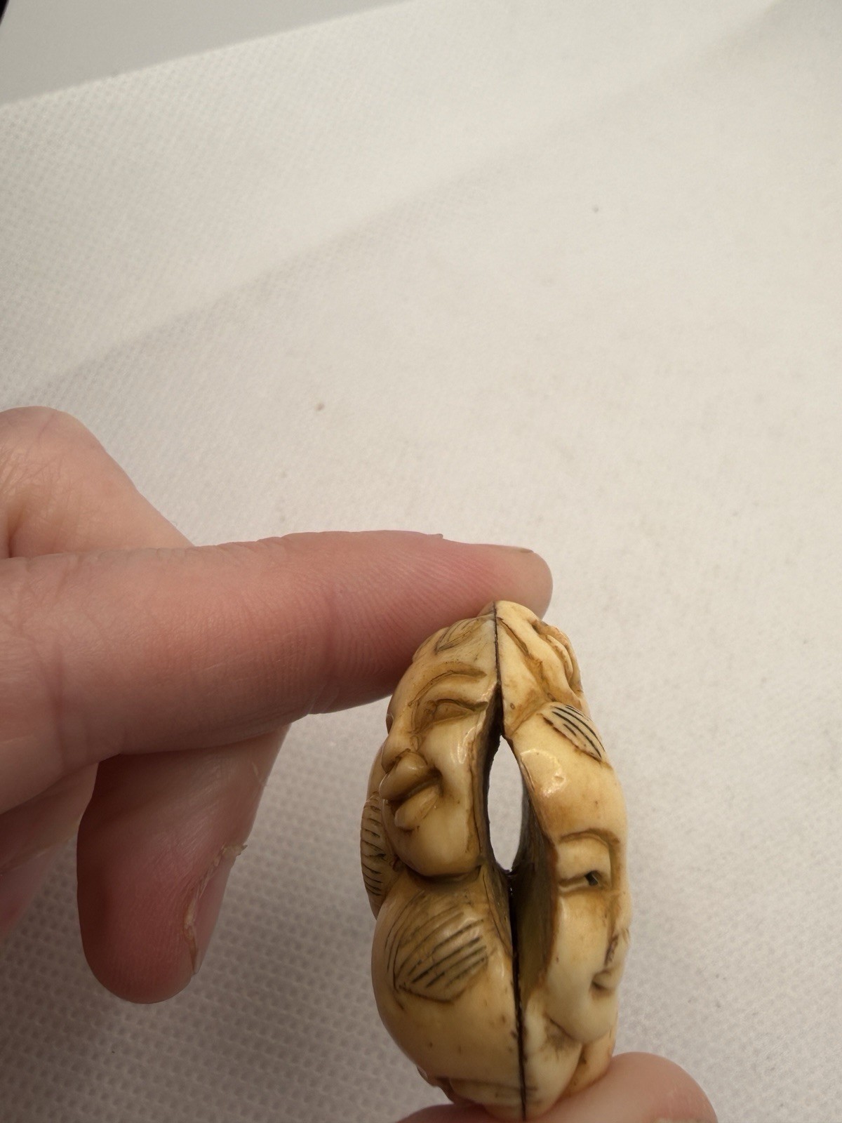 Japanese Carved Netsuke – Circular With Many Happy Faces And Geometric Shapes